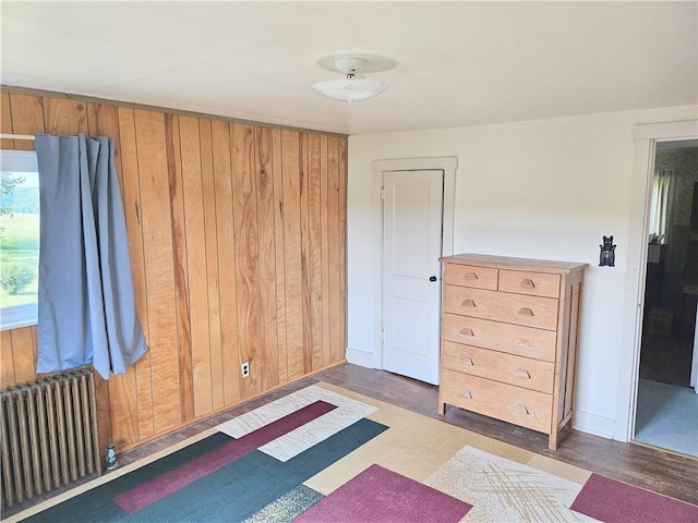 169 Fergus Rd, Slippery Rock Twp But, PA 16057 - bedroom featuring radiator, wood finished floors, and wood walls