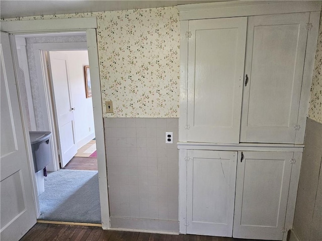 169 Fergus Rd, Slippery Rock Twp But, PA 16057 - interior space featuring dark wood-type flooring, wallpapered walls, and wainscoting