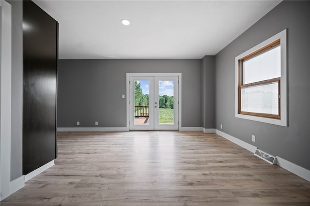 736 Shenango Stop Rd, Shenango Twp Law, PA 16101 - unfurnished room with light wood-style floors, recessed lighting, and french doors