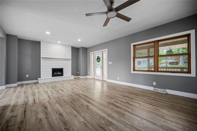 736 Shenango Stop Rd, Shenango Twp Law, PA 16101 - unfurnished living room with a ceiling fan, wood finished floors, recessed lighting, and a large fireplace