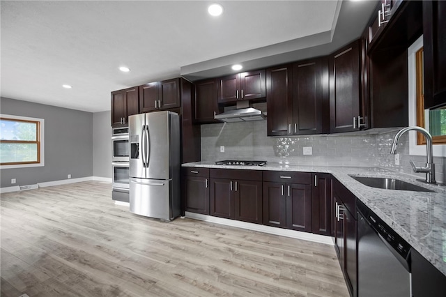 736 Shenango Stop Rd, Shenango Twp Law, PA 16101 - kitchen with appliances with stainless steel finishes, exhaust hood, decorative backsplash, recessed lighting, and light stone counters