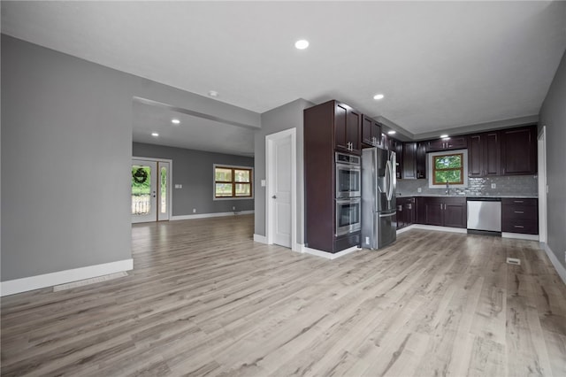 736 Shenango Stop Rd, Shenango Twp Law, PA 16101 - kitchen featuring stainless steel appliances, open floor plan, light wood-style flooring, backsplash, and recessed lighting