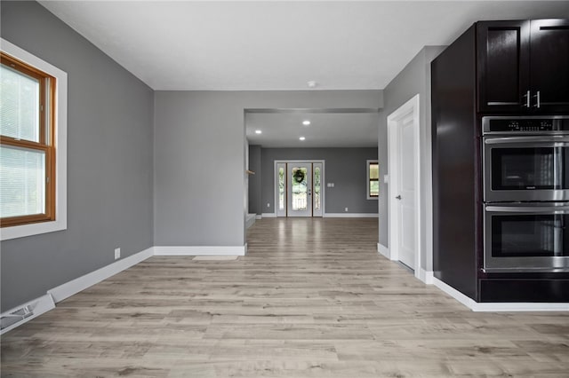 736 Shenango Stop Rd, Shenango Twp Law, PA 16101 - kitchen featuring stainless steel double oven, light wood finished floors, recessed lighting, dark cabinets, and open floor plan