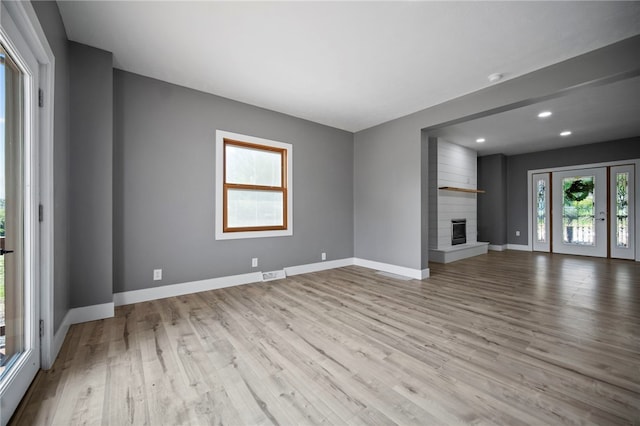 736 Shenango Stop Rd, Shenango Twp Law, PA 16101 - unfurnished living room with wood finished floors, recessed lighting, and a large fireplace