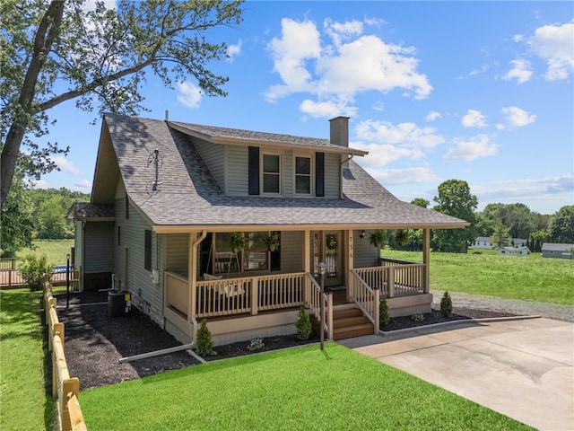 736 Shenango Stop Rd, Shenango Twp Law, PA 16101 - view of front of home featuring a chimney, a porch, a shingled roof, and a front yard