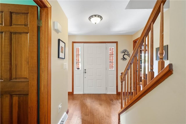 10174 Woodbury Dr, Mccandless, PA 15090 - entrance foyer with wood finished floors and stairway