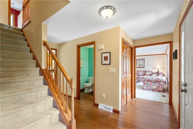 10174 Woodbury Dr, Mccandless, PA 15090 - stairs featuring wood finished floors and baseboards