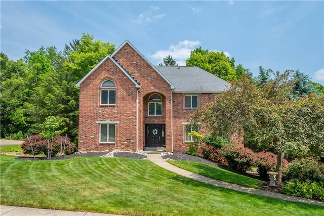 10174 Woodbury Dr, Mccandless, PA 15090 - traditional-style house featuring a front lawn and brick siding