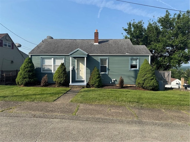 10 Crest St, Uniontown, PA 15401 - view of front of house with a chimney, a front yard, and roof with shingles