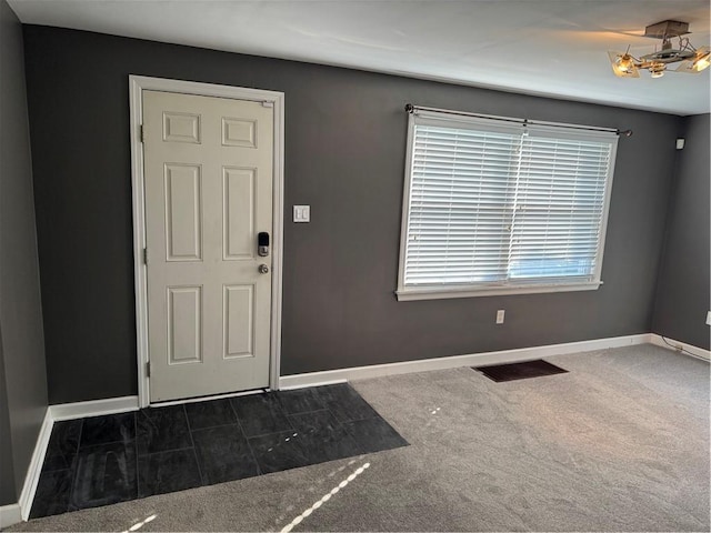 10 Crest St, Uniontown, PA 15401 - carpeted entrance foyer featuring baseboards and a chandelier