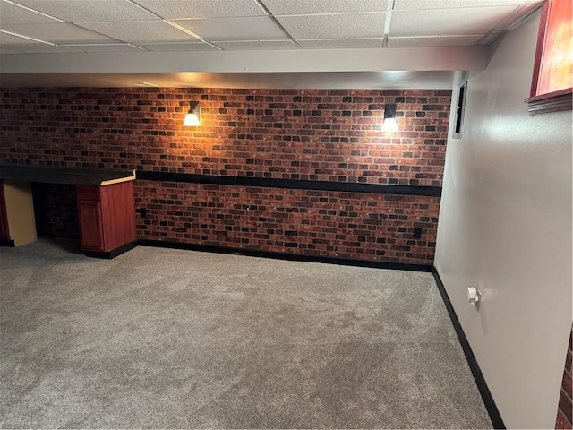 10 Crest St, Uniontown, PA 15401 - finished below grade area with carpet, brick wall, and a drop ceiling