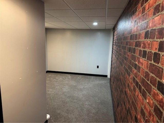 10 Crest St, Uniontown, PA 15401 - spare room with carpet floors, brick wall, a paneled ceiling, and recessed lighting