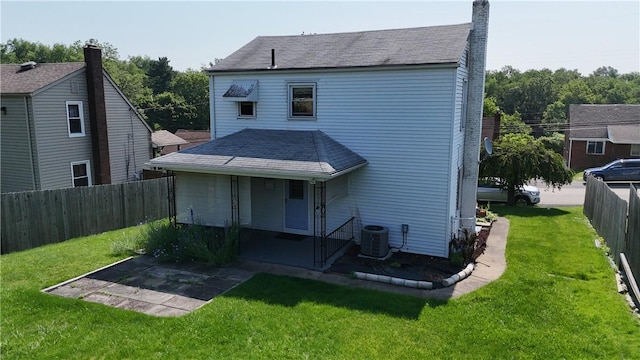 511 Oakhurst Ave N, Versailles, PA 15137 - rear view of property featuring a fenced backyard, a chimney, roof with shingles, and a patio area