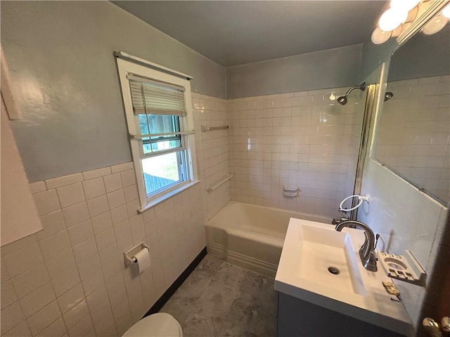 511 Oakhurst Ave N, Versailles, PA 15137 - full bath featuring vanity, tile walls, tub / shower combination, and a wainscoted wall