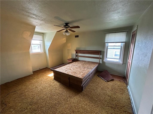 511 Oakhurst Ave N, Versailles, PA 15137 - bedroom with a textured ceiling, multiple windows, carpet floors, and ceiling fan