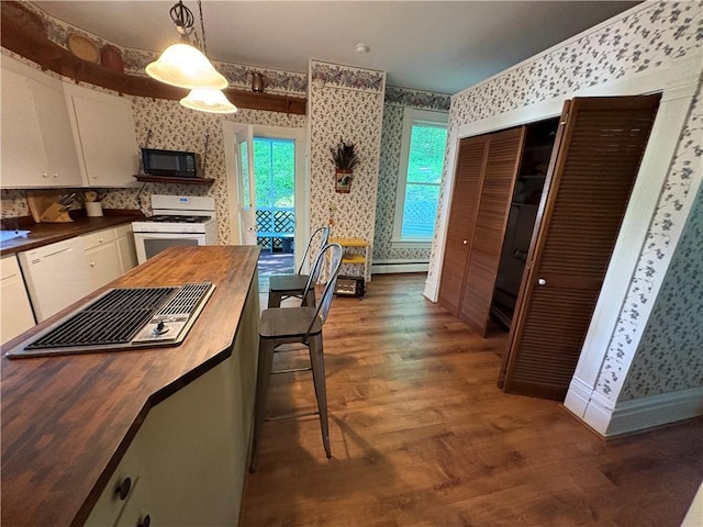 304 Jefferson St, Brookville Area School District, PA 15825 - kitchen with white appliances, wallpapered walls, wooden counters, white cabinetry, and wood finished floors