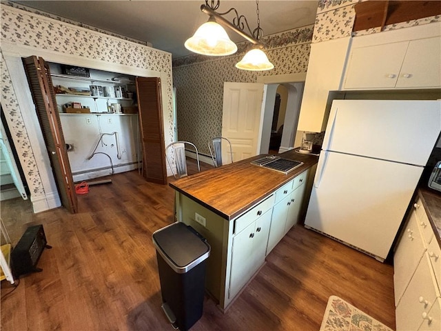 304 Jefferson St, Brookville Area School District, PA 15825 - kitchen featuring wallpapered walls, freestanding refrigerator, baseboard heating, arched walkways, and dark wood-style floors