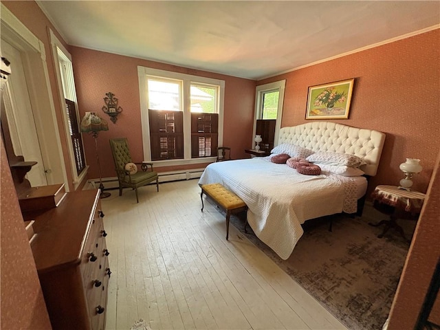 304 Jefferson St, Brookville Area School District, PA 15825 - bedroom with light wood-type flooring, baseboard heating, and ornamental molding