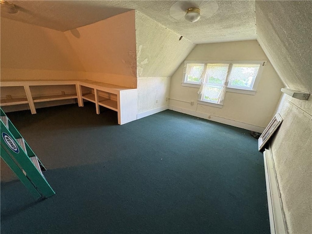304 Jefferson St, Brookville Area School District, PA 15825 - bonus room featuring a textured ceiling, lofted ceiling, and dark carpet