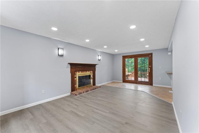 320 Penn Lear Ct, Monroeville, PA 15146 - unfurnished living room featuring a fireplace, light wood finished floors, and recessed lighting