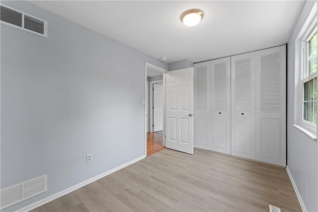 320 Penn Lear Ct, Monroeville, PA 15146 - unfurnished bedroom with light wood-type flooring and a closet
