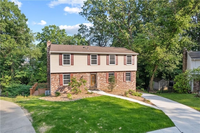 320 Penn Lear Ct, Monroeville, PA 15146 - colonial inspired home featuring a chimney, brick siding, and a front yard