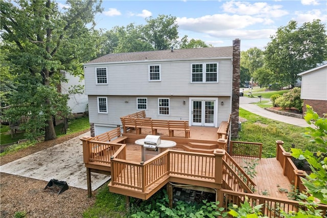 320 Penn Lear Ct, Monroeville, PA 15146 - rear view of house featuring a chimney, french doors, a deck, and an attached garage