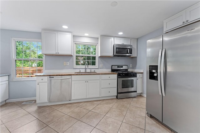 320 Penn Lear Ct, Monroeville, PA 15146 - kitchen featuring appliances with stainless steel finishes, healthy amount of natural light, white cabinets, and recessed lighting