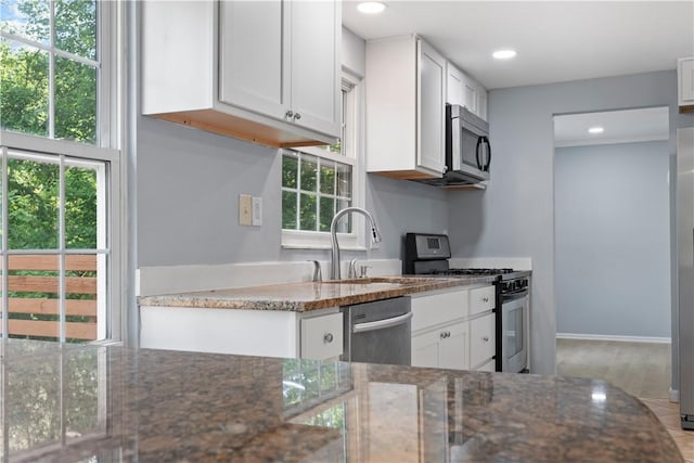 320 Penn Lear Ct, Monroeville, PA 15146 - kitchen featuring appliances with stainless steel finishes, white cabinets, dark stone countertops, and recessed lighting