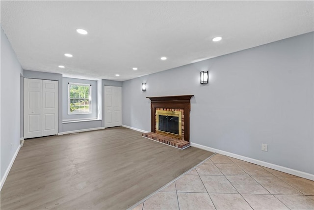 320 Penn Lear Ct, Monroeville, PA 15146 - unfurnished living room featuring recessed lighting, a fireplace, and wood finished floors