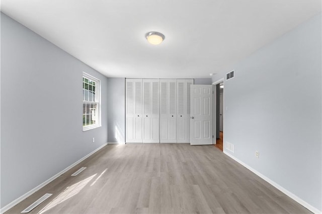 320 Penn Lear Ct, Monroeville, PA 15146 - unfurnished bedroom featuring light wood-style flooring and a closet