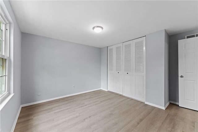 320 Penn Lear Ct, Monroeville, PA 15146 - unfurnished bedroom featuring wood finished floors and a closet