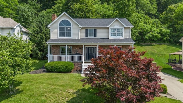 3004 Woodfield Dr, Hopewell Twp Bea, PA 15001 - traditional-style house featuring a porch, a chimney, a front yard, brick siding, and a shingled roof