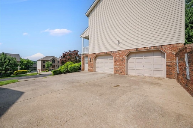 3004 Woodfield Dr, Hopewell Twp Bea, PA 15001 - view of side of home featuring a garage, driveway, and brick siding