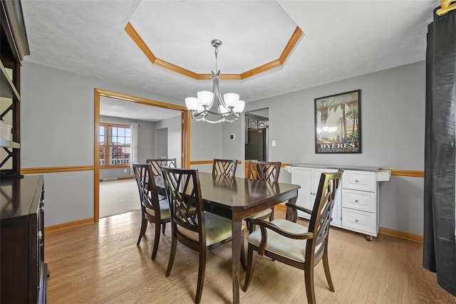 3004 Woodfield Dr, Hopewell Twp Bea, PA 15001 - dining space with light wood-style flooring, a chandelier, and a tray ceiling