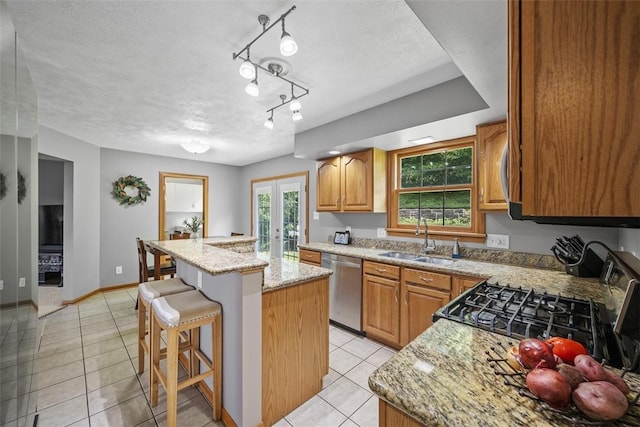 3004 Woodfield Dr, Hopewell Twp Bea, PA 15001 - kitchen featuring stainless steel appliances, light tile patterned floors, a center island, light stone counters, and a breakfast bar area