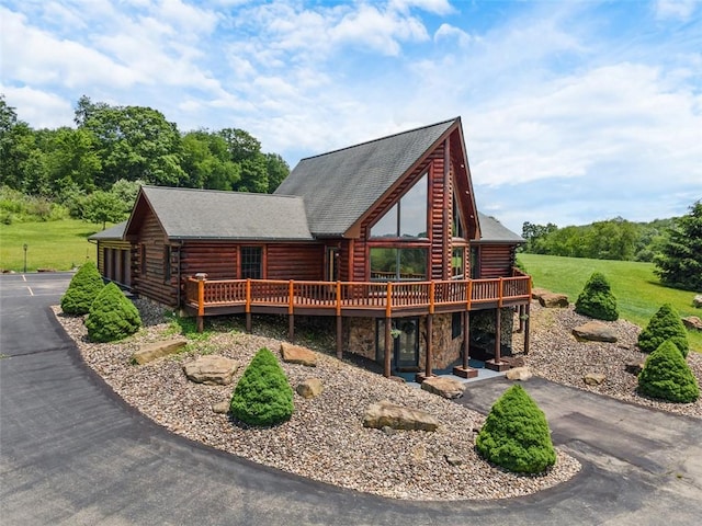 1155 Sarver Rd, South Buffalo Twp, PA 16055 - view of front of house with log siding, a deck, stone siding, and a shingled roof