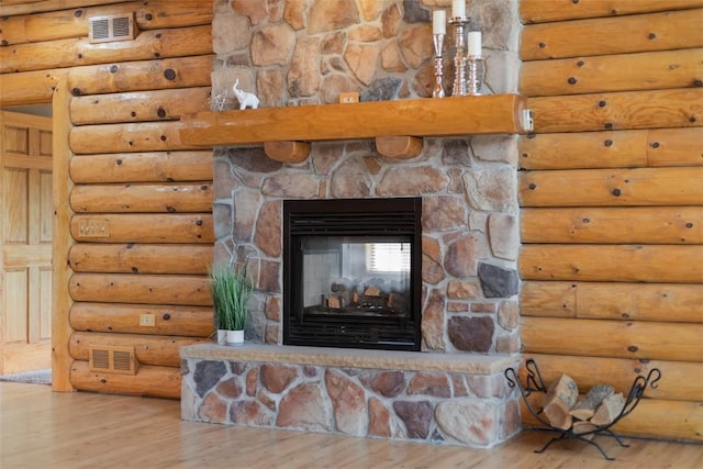 1155 Sarver Rd, South Buffalo Twp, PA 16055 - detailed view of wood finished floors, a stone fireplace, and log walls