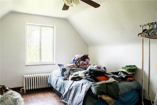 819 Toman Ave, Clairton, PA 15025 - bedroom with radiator heating unit, lofted ceiling, wood finished floors, and a ceiling fan