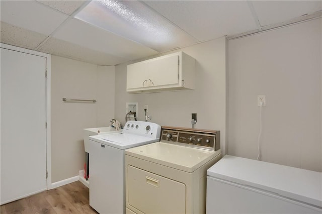 217 Baintree Rd, Moon/Crescent Twp, PA 15108 - laundry area with cabinet space, independent washer and dryer, and light wood-style floors