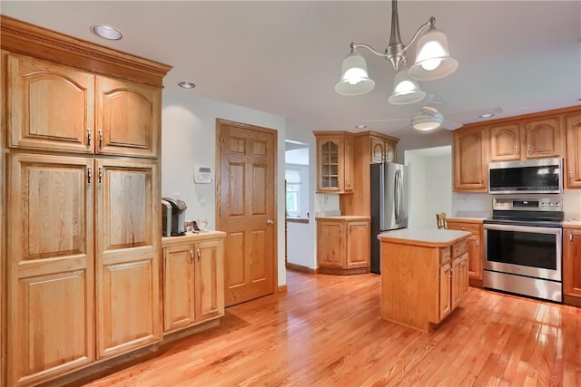 217 Baintree Rd, Moon/Crescent Twp, PA 15108 - kitchen featuring appliances with stainless steel finishes, light wood finished floors, light countertops, ceiling fan, and recessed lighting