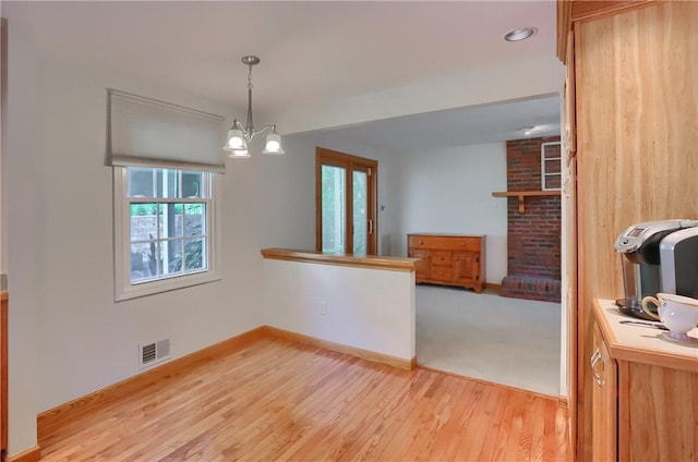 217 Baintree Rd, Moon/Crescent Twp, PA 15108 - unfurnished dining area with light wood-type flooring and a chandelier
