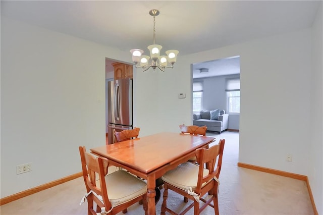217 Baintree Rd, Moon/Crescent Twp, PA 15108 - dining room with a chandelier and light carpet