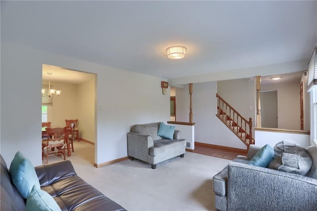217 Baintree Rd, Moon/Crescent Twp, PA 15108 - living area with a chandelier, stairway, and carpet flooring