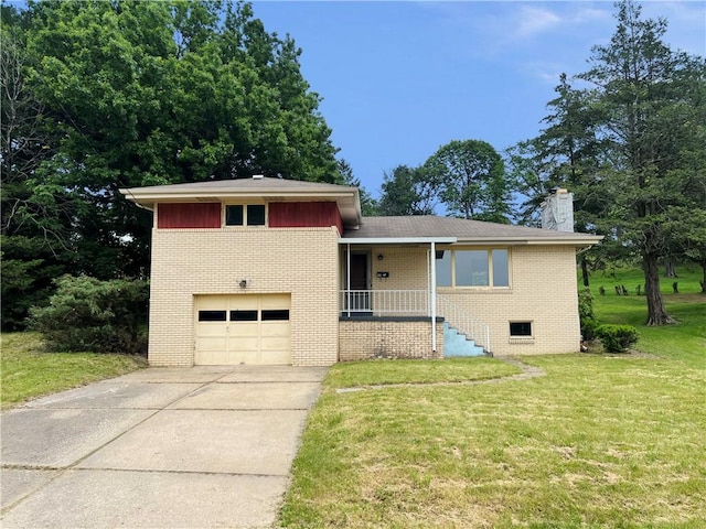 131 Monica Dr, Hempfield Twp Wml, PA 15601 - split level home featuring brick siding, an attached garage, a front lawn, concrete driveway, and a chimney