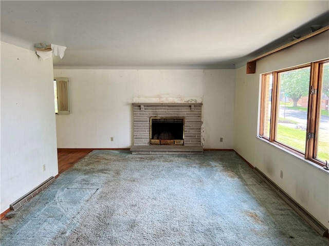 131 Monica Dr, Hempfield Twp Wml, PA 15601 - unfurnished living room with carpet and a fireplace