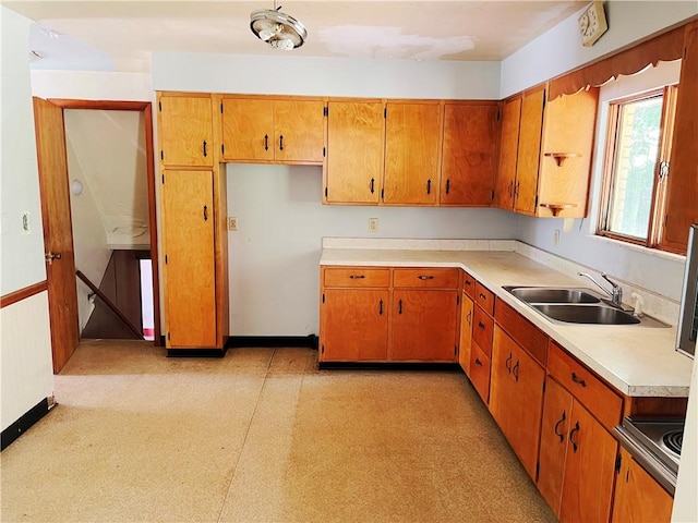 131 Monica Dr, Hempfield Twp Wml, PA 15601 - kitchen with light countertops, brown cabinetry, and light flooring