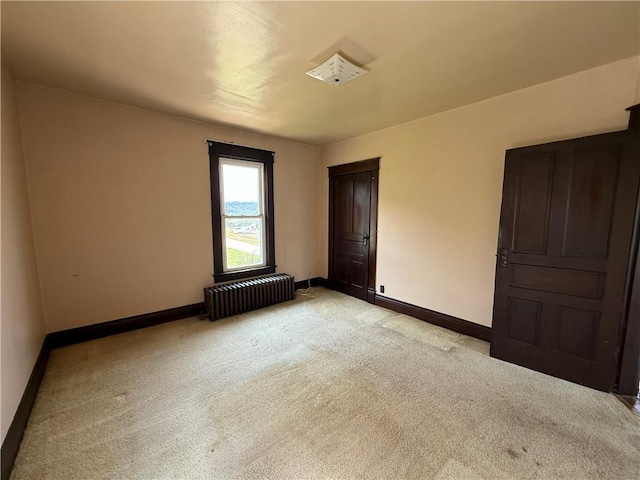 102 Bayard Ave, Dry Tav/Rices Landing, PA 15357 - unfurnished bedroom featuring radiator and light colored carpet