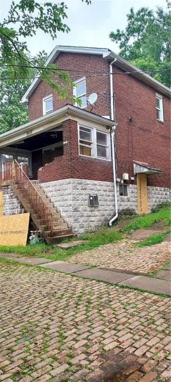 2517 S Braddock Ave, Swissvale, PA 15218 - rear view of property with stairs and brick siding