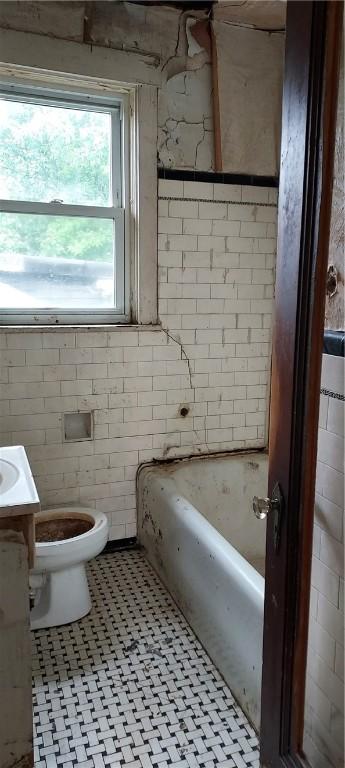 2517 S Braddock Ave, Swissvale, PA 15218 - bathroom with a bathtub, vanity, and tile patterned floors